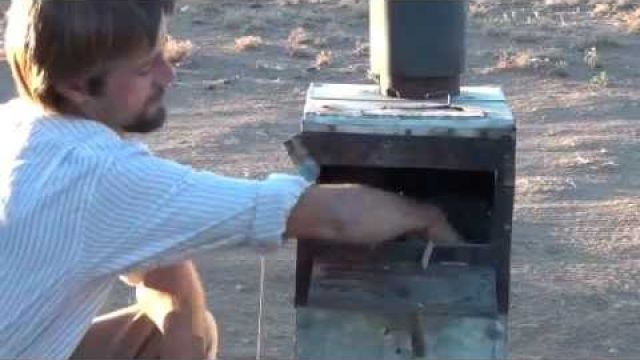 wood stove runs a generator, produces gasoline, runs a fridge and heats hot water at the same time